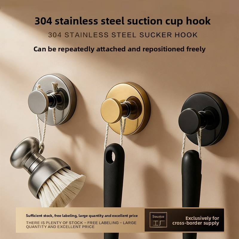 Neat Theory suction hooks in silver, gold and black on a wall